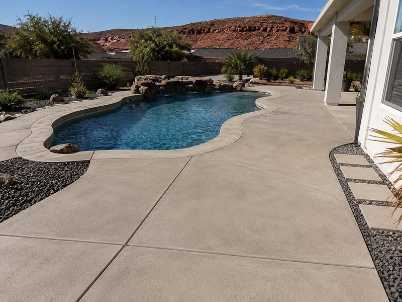 Concrete pool deck resurfacing before and after in Southern Utah